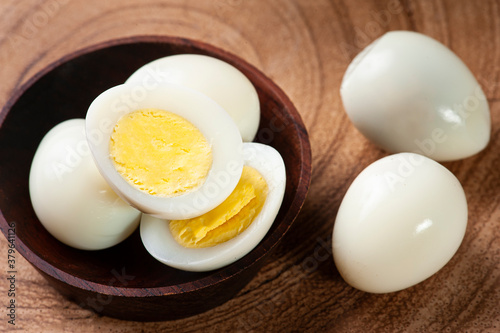 .Boiled quail eggs arranged on wooden background