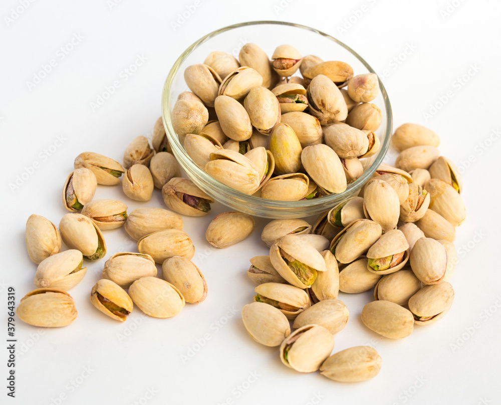 roasted pistachios on white background