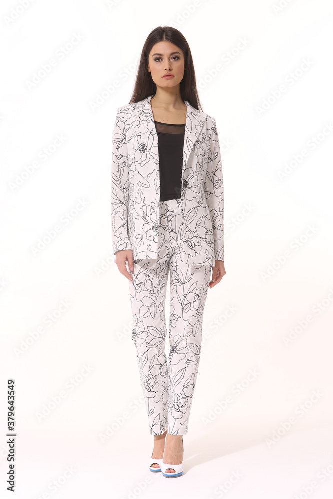 Obraz premium business woman executive in floral printed summer white pant suit - jacket and trousers
