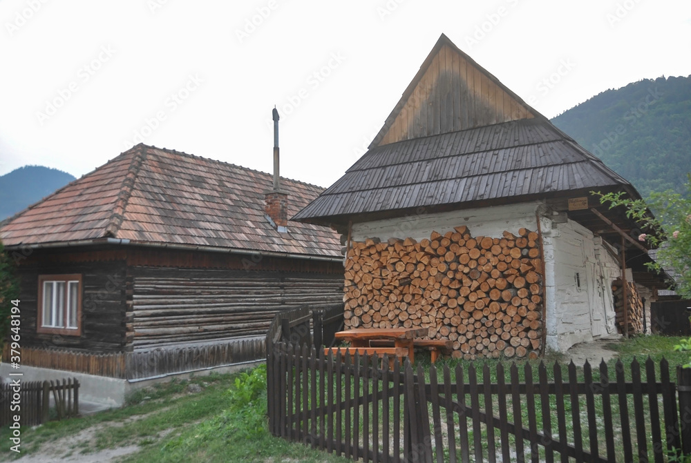 VLKOLINEC, SLOVAKIA, EUROPE, SUMMER 2015. Beautiful street in the center of Vlkolinec village, a Unesco heritage site. The houses are made of wood and painted in neutral colors.