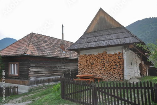 Obraz na płótnie VLKOLINEC, SLOVAKIA, EUROPE, SUMMER 2015. Beautiful street in the center of Vlkolinec village, a Unesco heritage site. The houses are made of wood and painted in neutral colors. w salonie