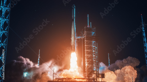 Launch Pad Complex: Successful Rocket Launching with Crew on a Space Exploration Mission. Flying Spaceship Blasts Flames and Smoke on a Take-Off. Humanity in Space, Conquering Universe photo