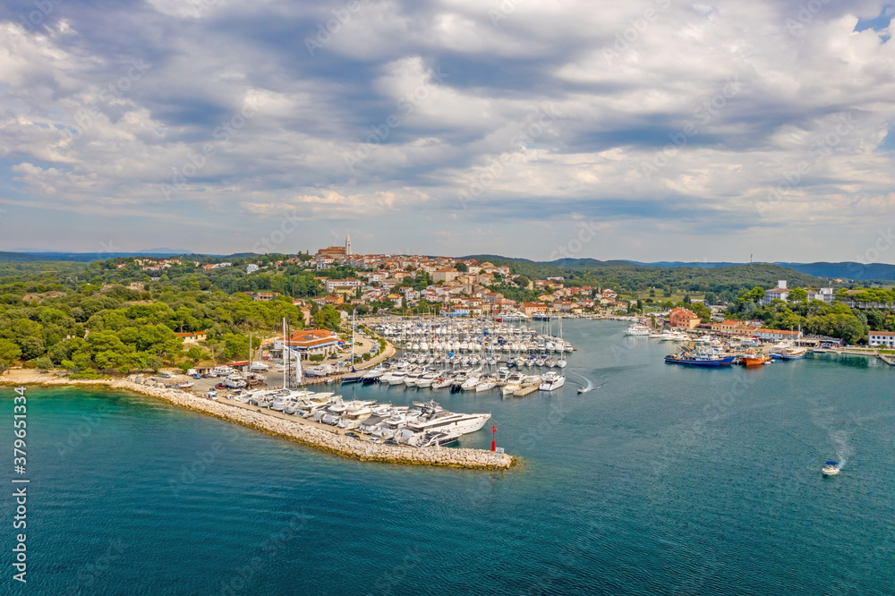 Aerial panoramic drone picture of Vrsar harbour in Croatia with turquoise water during daytime