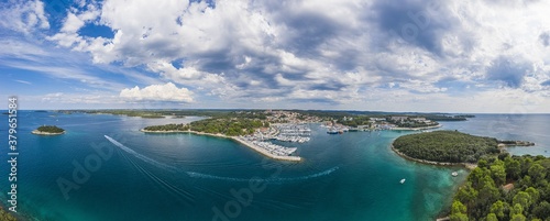 Aerial panoramic drone picture of Vrsar harbour in Croatia with turquoise water during daytime