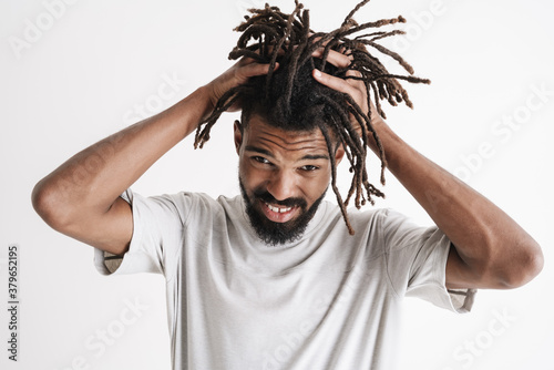 Tableau sur toile Photo of displeased african american guy grabbing her head