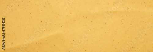 Russian mustard.The texture of the mustard.Yellow mustard background top view.