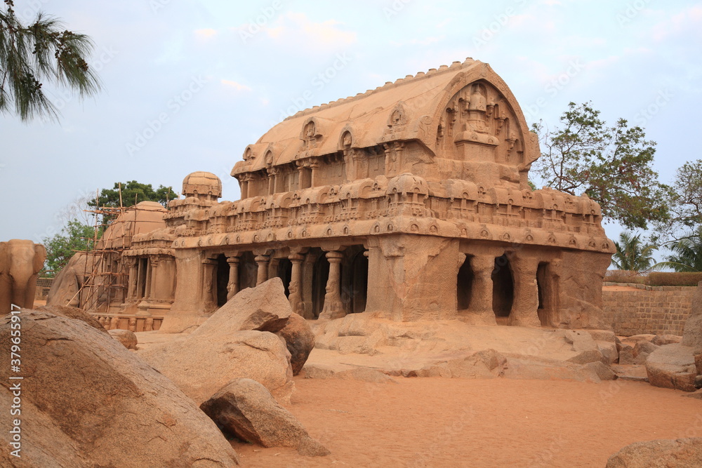 View of Ancient Monolithic temples Five Rathas (Indian: Pancha Rathas) of Mahapalipuram under sunset in Tamil Nadu, India