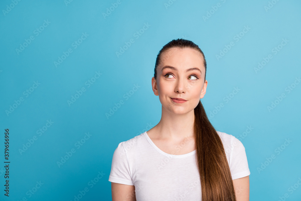 Portrait of minded pretty positive girl look copyspace think thoughts enjoy plan summer holiday wear casual style clothes isolated over blue color background Portrait of minded pretty positive girl look copyspace think thoughts enjoy plan summer holiday wear casual style clothes isolated over blue color background