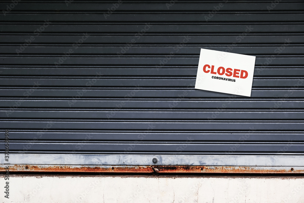 street store closes or lease amid the coronavirus pandemic. small shops had to close due to the economic crisis and lack of tourists. a closed sign on the old metallic roller shutter door. street store closes or lease amid the coronavirus pandemic. small shops had to close due to the economic crisis and lack of tourists. a closed sign on the old metallic roller shutter door.