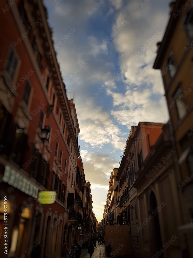 Street in Rome, Italy. Rome buildings with a cloudy sky.
