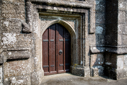 Old Norman Church Door with Iron rivets and a Stone Arch