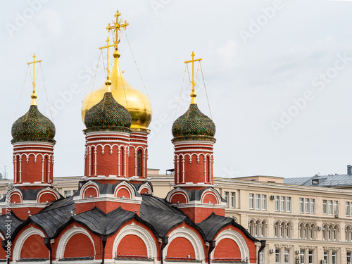 view of church of Znamensky monastery in the Old Tsar's yard from Zaryadye Park on Varvarka street in September photo