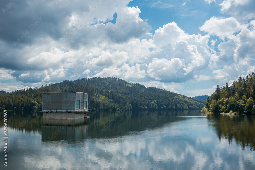View of water dam or Vodna Nadrz in Nova Bistryca, Slovakia. Detail of house with turbines. Big water dam and reservoir for the safety of the people and energy generation.