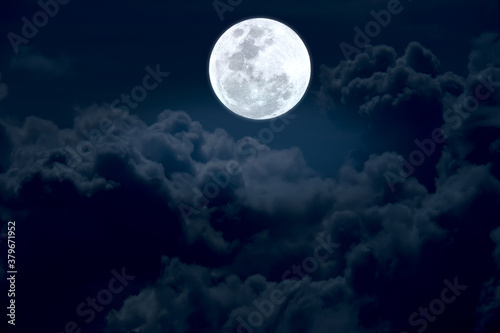 Full moon in the sky with clouds.