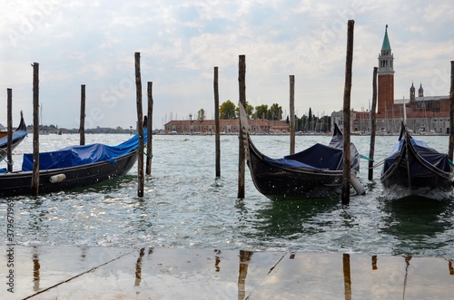 Gondolas in Venice with Saint Giorgio island in the morning, seen from San Marco square, Italy
