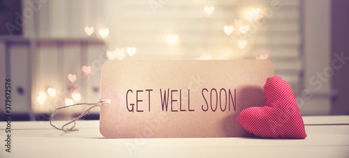 Get well soon message with a red heart with heart shaped lights