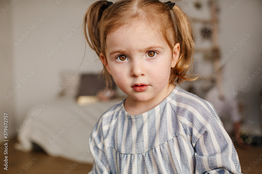 Children, family and holiday concept. Portrait of a three-year-old dark-haired girl. Serious child. Children, family and holiday concept. Portrait of a three-year-old dark-haired girl. Serious child.