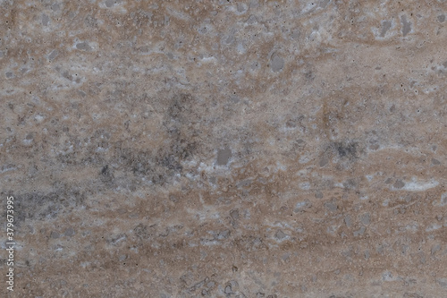 beige granite wall with gray stains - texture