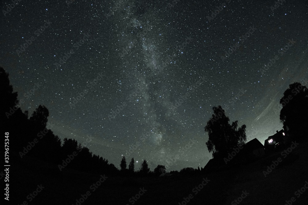 Blue dark night sky with many stars. Night sky over rural landscape. high ISO landscape with fisheye lens Blue dark night sky with many stars. Night sky over rural landscape. high ISO landscape with fisheye lens