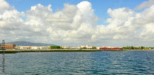 Beautiful view of Olhao sailing through the Ria Formosa Natural Park. Olhao is a famous coastal town in Algarve Region near Faro, southern Portugal