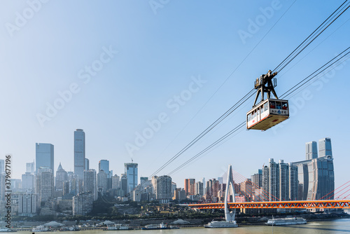 Scenery of high-rise buildings and Yangtze River cableway in Chongqing, China
