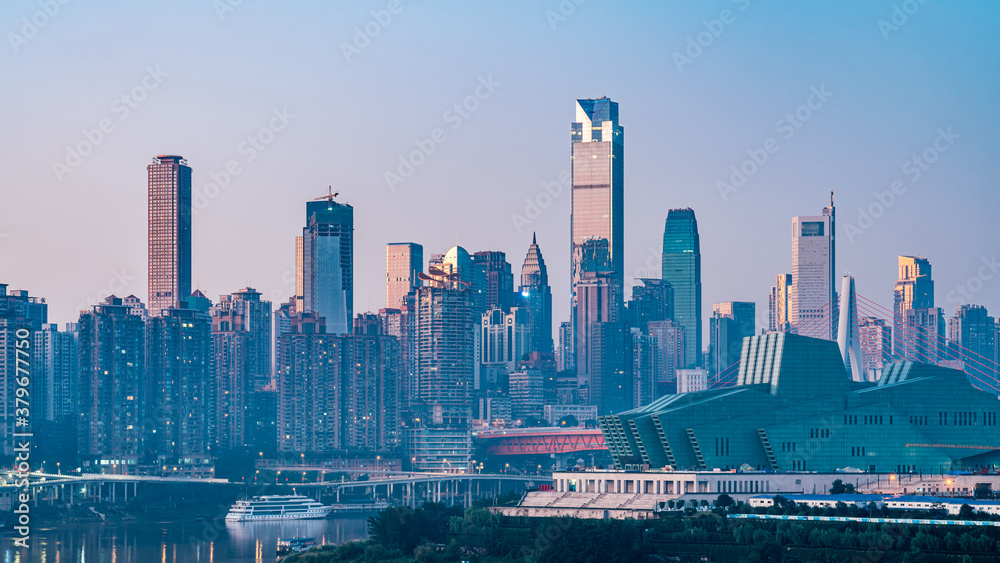 Fototapeta premium Night view of tall buildings along Chaotianmen in Chongqing, China and Chongqing Grand Theater