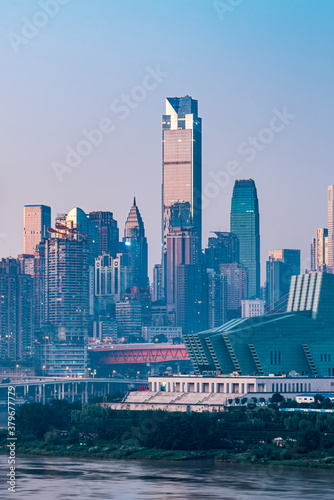 Night view of tall buildings along Chaotianmen in Chongqing, China and Chongqing Grand Theater photo