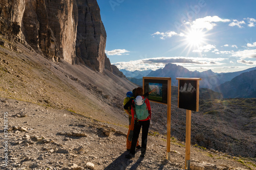 Hikers on the Forcella Lavaredo consult the map. photo