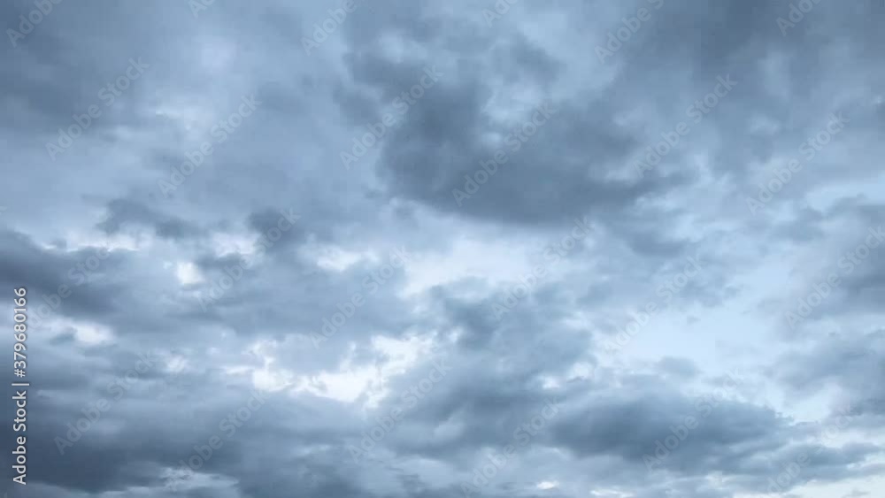 TIME LAPSE - Blue clouds moving fast through the sky. TIME LAPSE - Blue clouds moving fast through the sky.