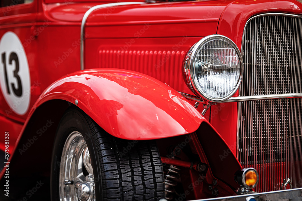 closeup of red restored retro sport car front
