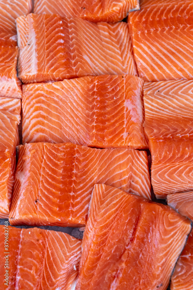 Raw Salmon Fillets on Ice for Sale at Market Raw Salmon Fillets on Ice for Sale at Market