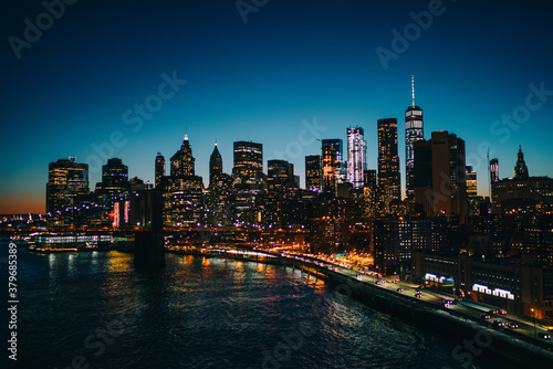 Manhattan skyscrapers and Brooklyn bridge at night © BullRun