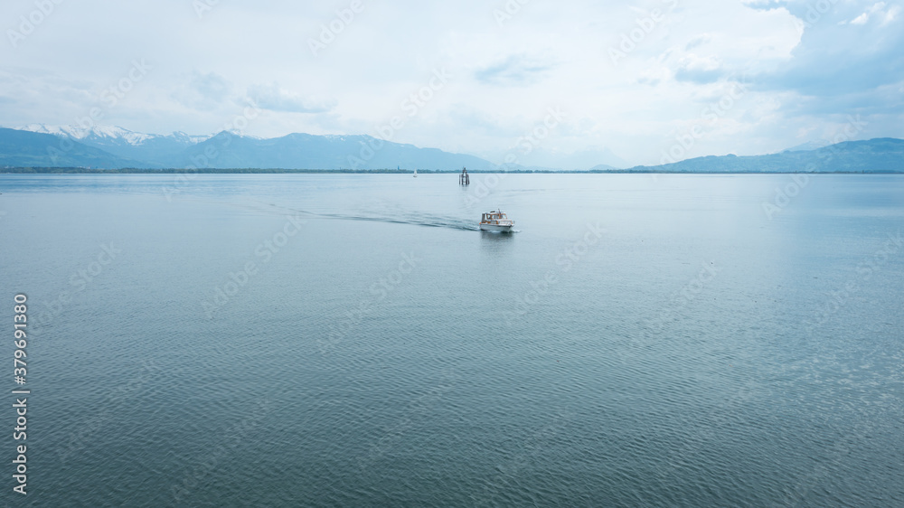 Small boat on Lake Constance, on a cloudy day Small boat on Lake Constance, on a cloudy day