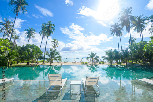 Beautiful view of swimming pool with Green tropical garden in cozy resort, phi phi island, Thailand © tonefotografia