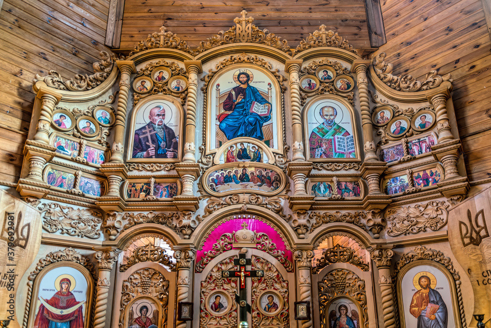 Obraz premium Ancient wooden building of the Orthodox Church in the village. Church of St. Peter the Long-suffering (Kalnishevsky)