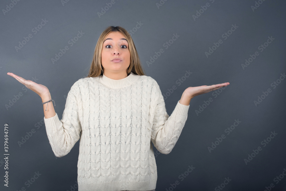 Puzzled and clueless young woman with arms out, shrugging her shoulders, saying: who cares, so what, I don't know. Negative human emotions, facial expressions, life perception and attitude.
Puzzled and clueless young woman with arms out, shrugging her shoulders, saying: who cares, so what, I don't know. Negative human emotions, facial expressions, life perception and attitude.