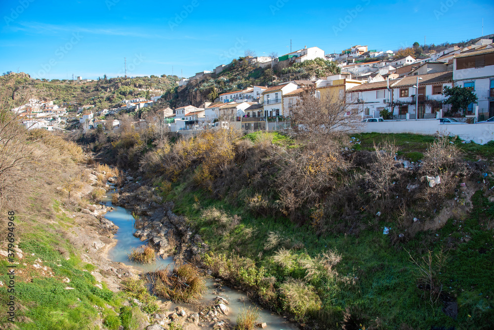 
neighborhood of Pinos Puente with the river, town in the province of Granada
