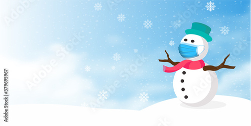 Snowman wearing protective medical mask in winter to protect against coronavirus
