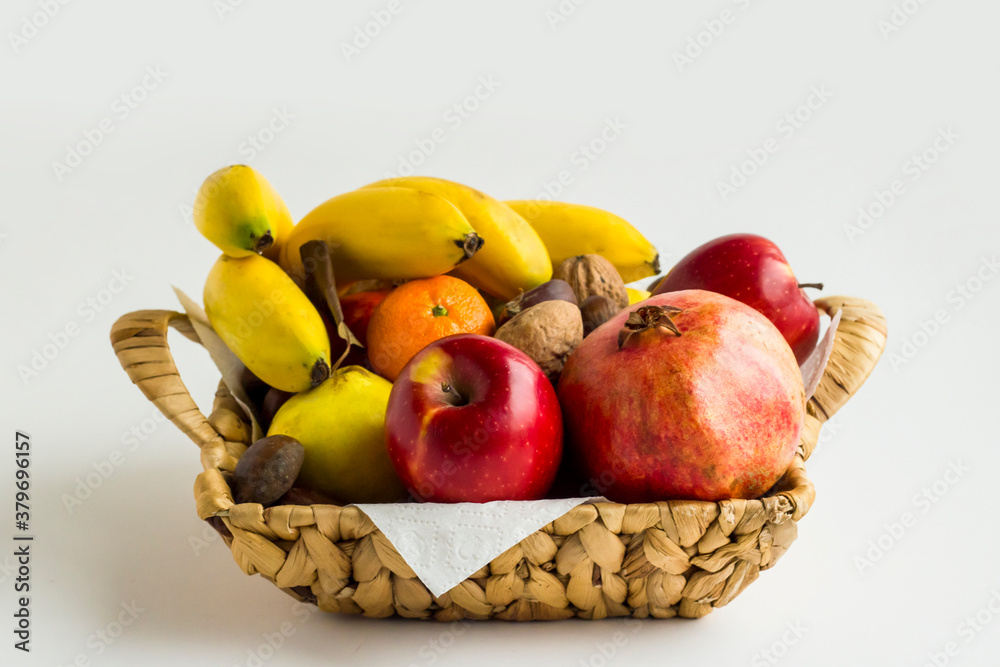 Mixed,fresh fruits in wicker basket on white background, Mixed,fresh fruits in wicker basket on white background,