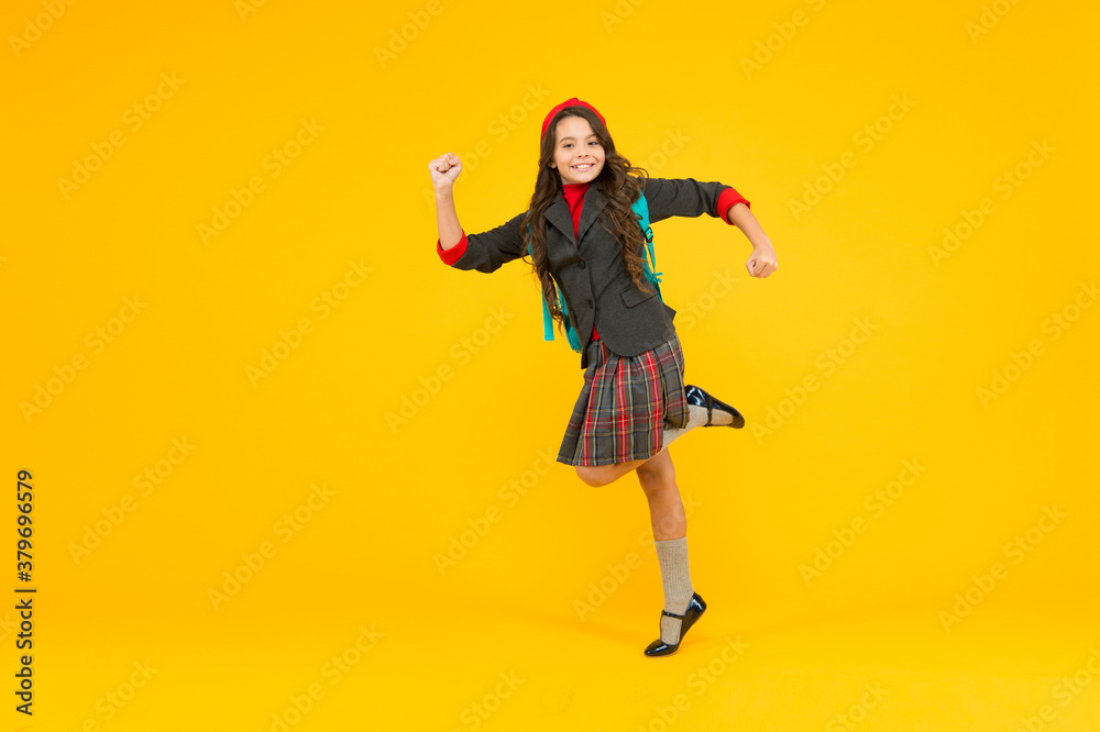 First steps on ladder of success. Energetic child hurry to school. Primary education. Formal fashion and style. Private teaching. Knowledge day. September 1. Happy and energetic First steps on ladder of success. Energetic child hurry to school. Primary education. Formal fashion and style. Private teaching. Knowledge day. September 1. Happy and energetic