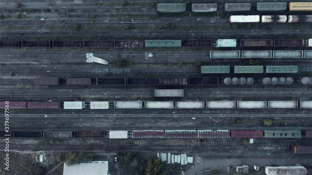 Many empty freight cars standing on railways aerial view, cargo transportation Many empty freight cars standing on railways aerial view, cargo transportation