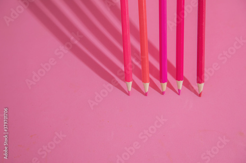 Fototapeta Naklejka Na Ścianę i Meble -  pink background with pink wooden pencils