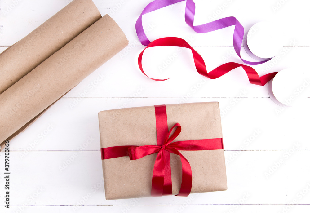 Fototapeta premium Packed eco gifts on a wooden background