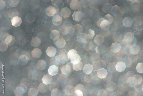 abstract silver bokeh background from glitter