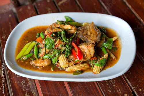 Spicy stir-fried fish with pepper, chili . Stir fried fish with Thai herbs, spicy local food, the unique spice of Thai food. image for objects copy space and menu list. fire Catfish Spicy