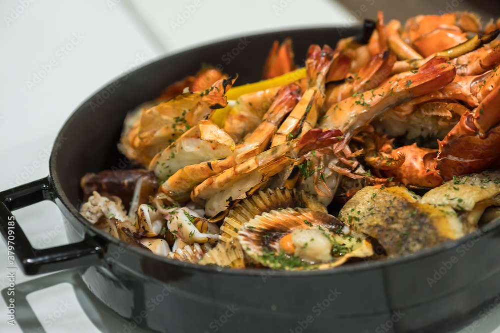 Seafood platter. Grilled lobster and sea food on pan. Seafood platter. Grilled lobster and sea food on pan.