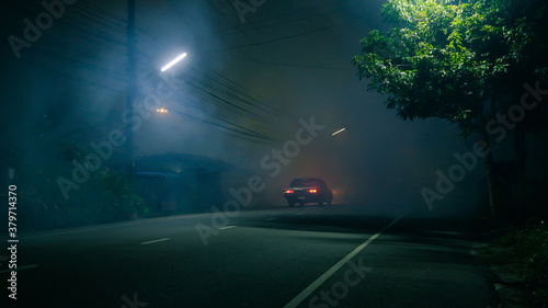 Classic car drive into abandoned road with large of smoke