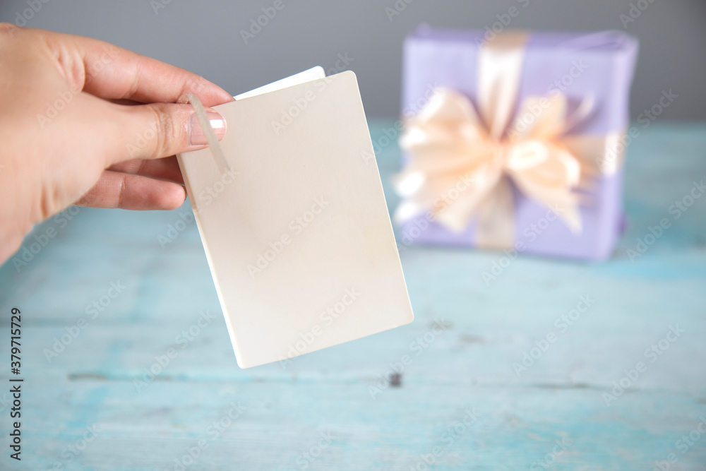 Obraz premium woman hand card and gift box