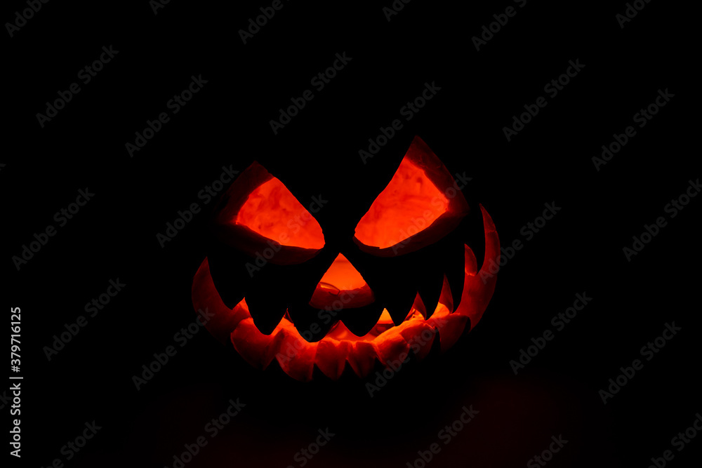 Spooky halloween pumpkin on a black background