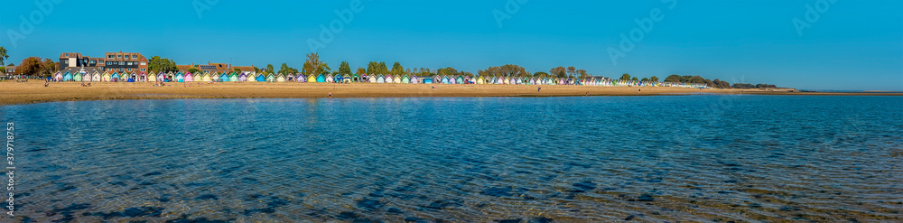A panorama view towards the shore and beach at West Mersea, UK in the summertime